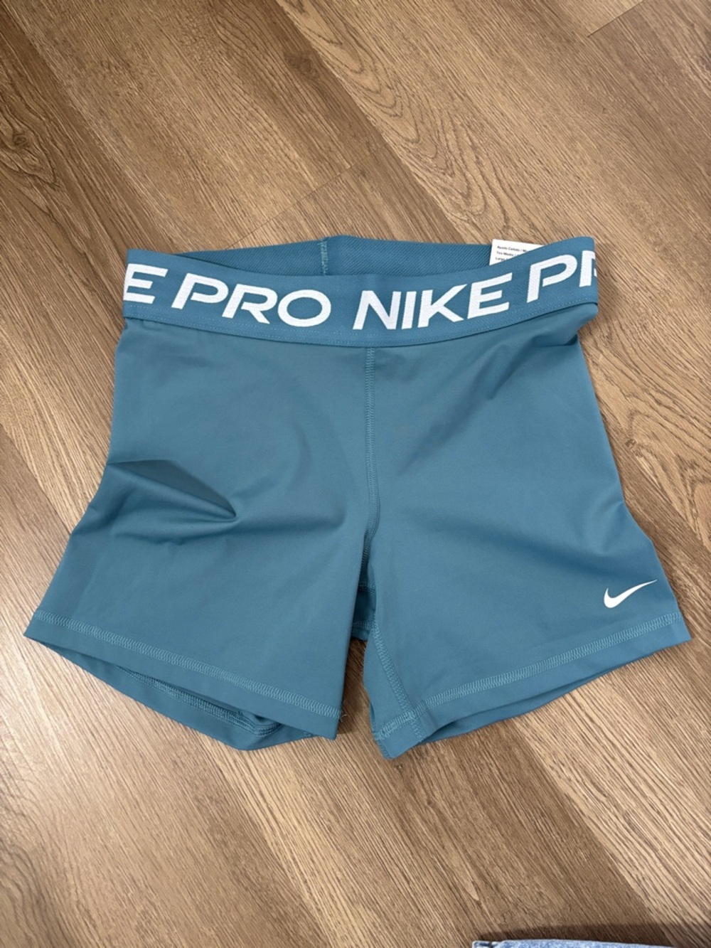 Nike Teal Athletic Pro Shorts with White Swoosh